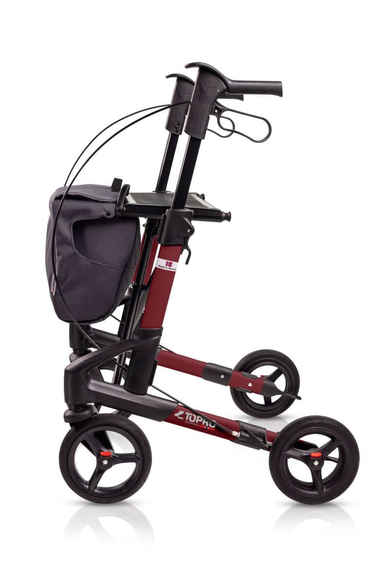 Seitenansicht eines Rollators in der Farbe Bordeauxrot mit schwarzer geschlossener Tasche, Modell Troja 5G Black series von Mobio
