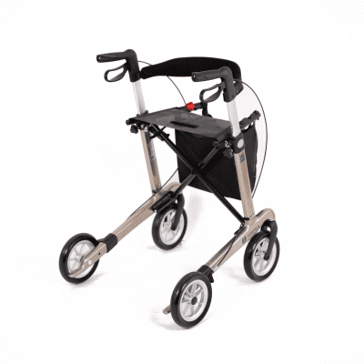 Seitenansicht, nach hinten, rechts, Modell Carlbon von SMINA, Carbon-Rollator, Farbe Champagner, mit Tasche, Rückengurt und Softbereifung