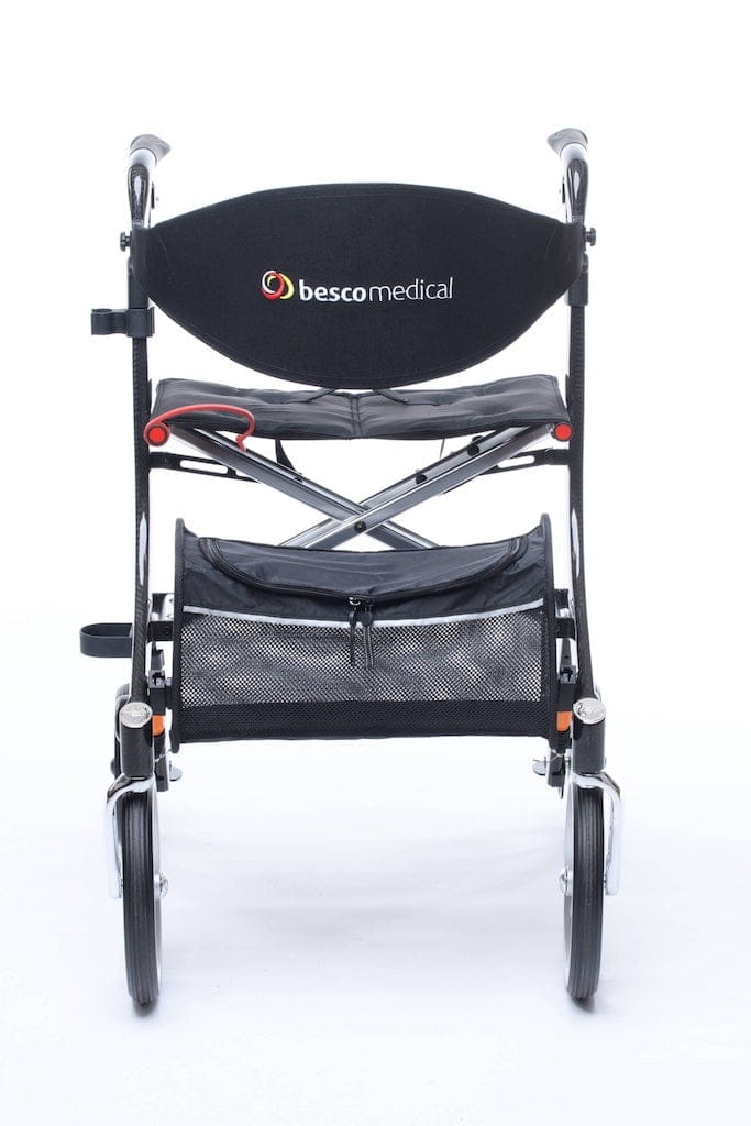 Carbon Rollator von Bescomedical, Frontansicht eines graphitgrauen Rollators mit Rückengurt und Einkaufstasche